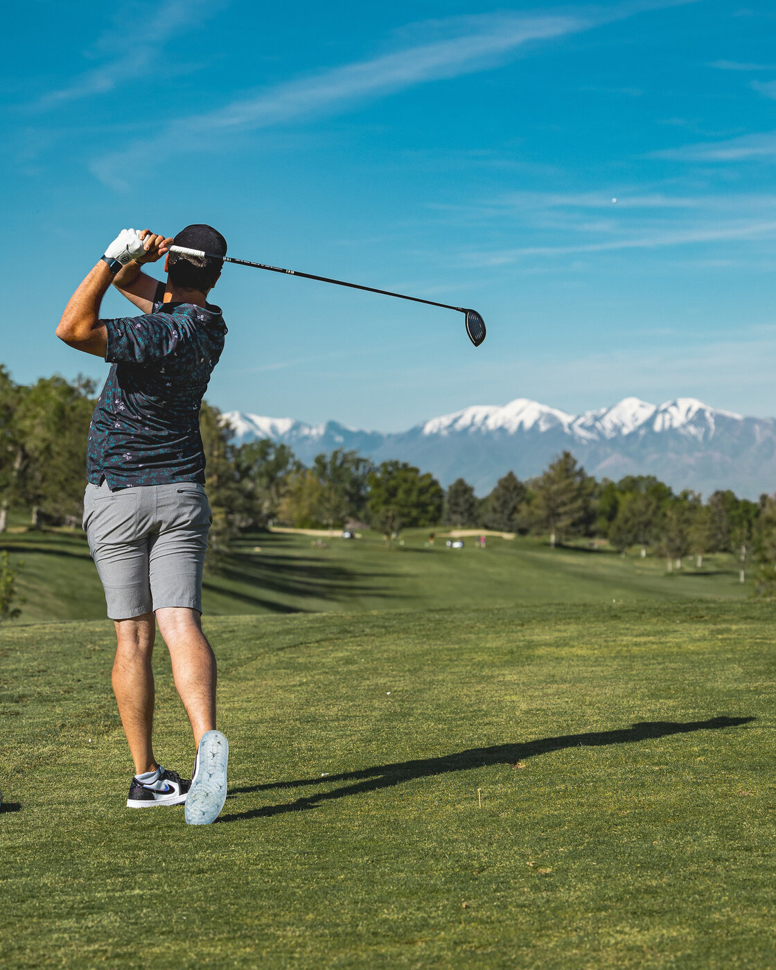 Coach Mike Yates mid-swing, close up